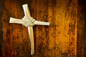 Cross Made From Palm Sunday Branch on Old Wooden Bench